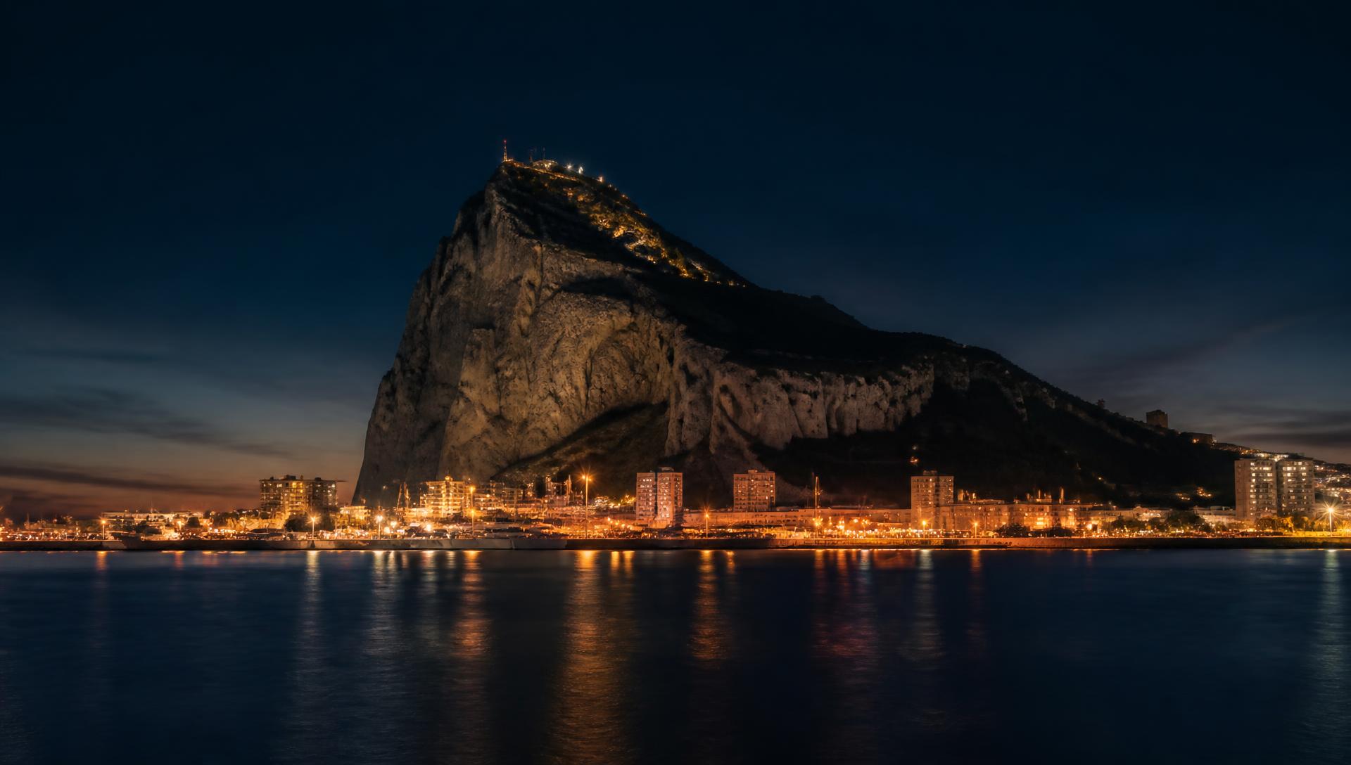The Rock of Gibraltar at dusk seen from the bay
